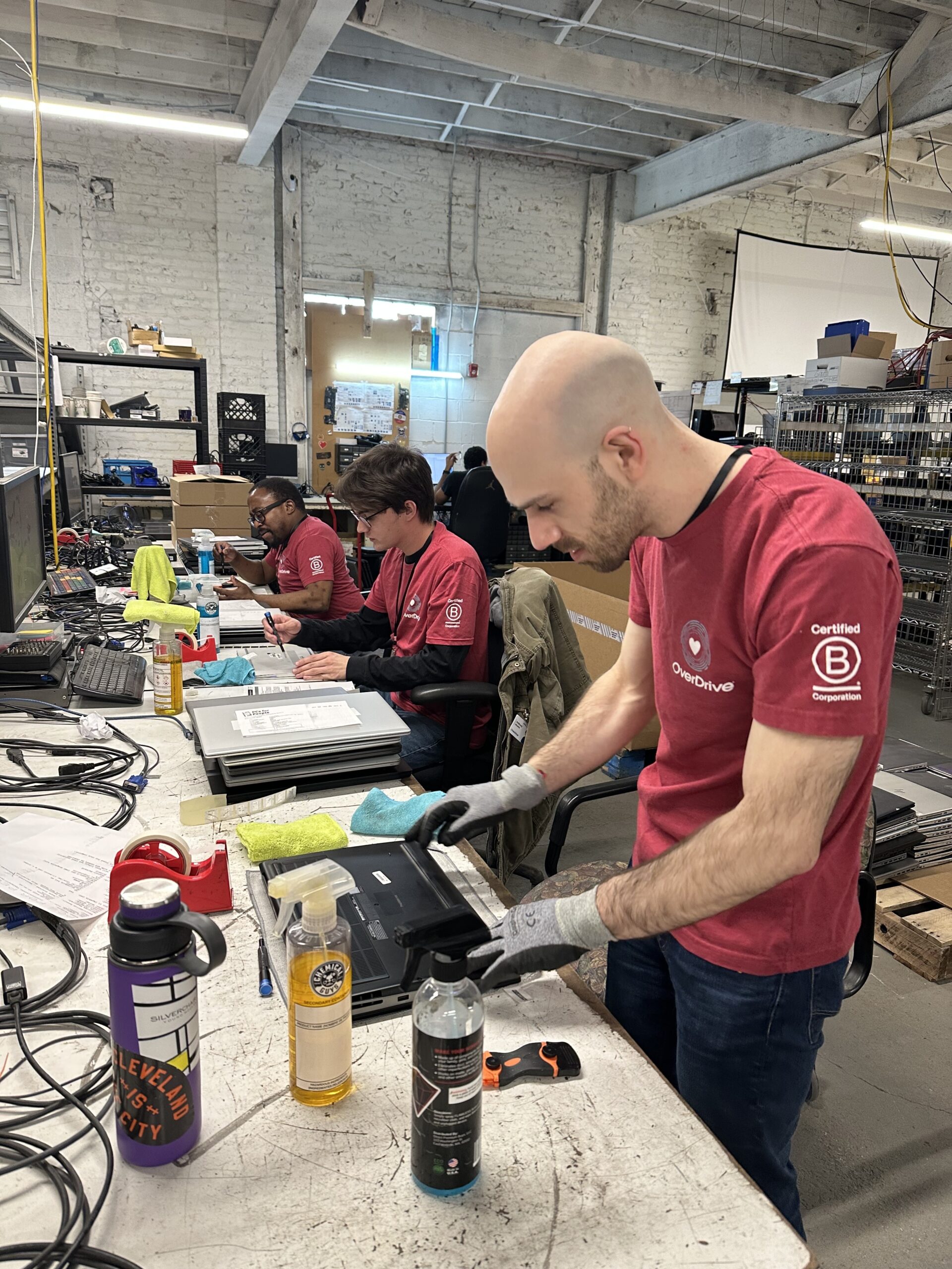 Employees working in a warehouse at a volunteer event