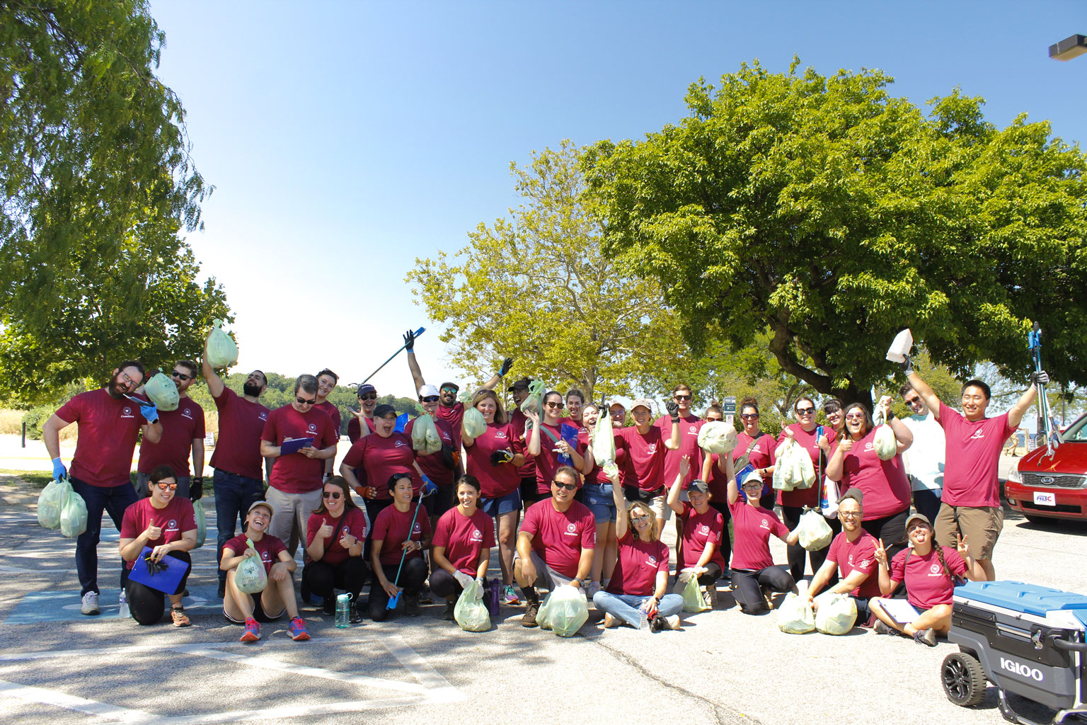 A large group of employees posing joyfully after a volunteer event