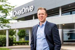 OverDrive CEO Marc DeBevoise stands in front of OverDrive's Blue Sky Campus, headquartered in Cleveland, Ohio.